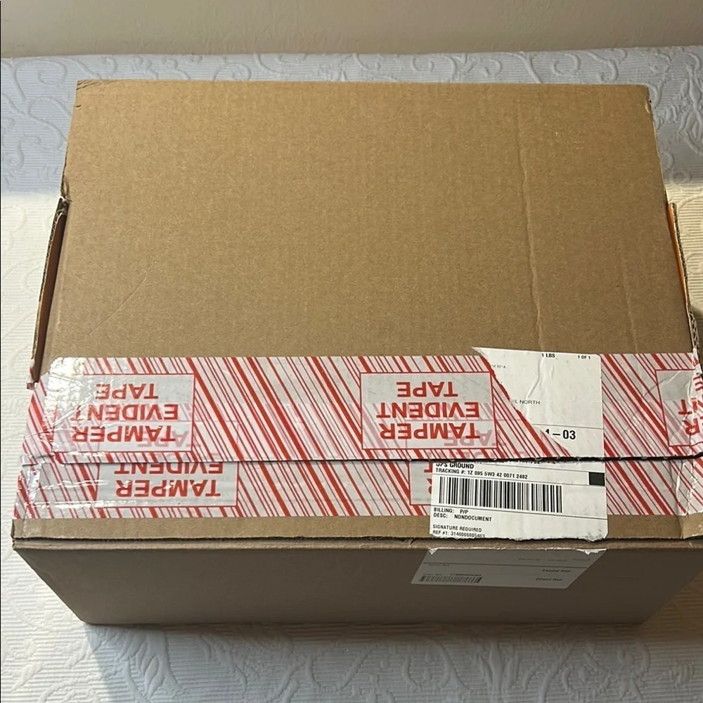 Louis Vuitton Signature  Box inside a LV shipping box with tissue and ribbon.